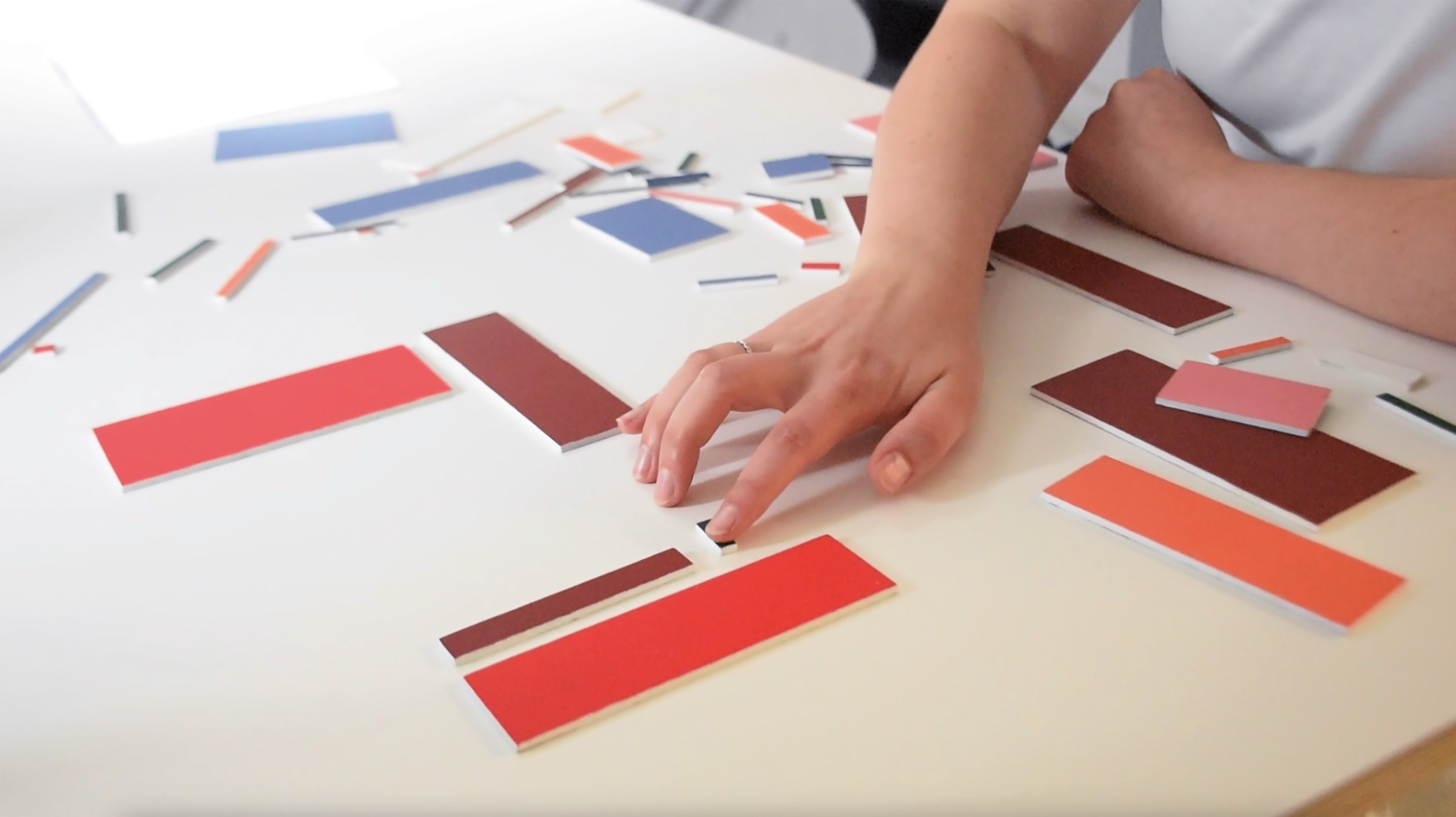 Kika arranging generated design elements by hand