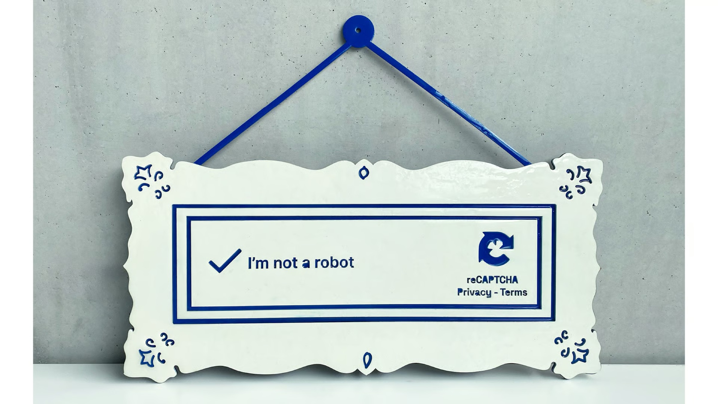 I'm not a robot — a ceramic reCAPTCHA sign questioning the nature of human identity